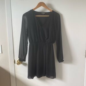 Express black long sleeve mini dress with sheer sleeves.